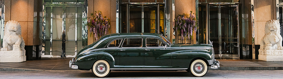 Packard vehicle in front of entrance